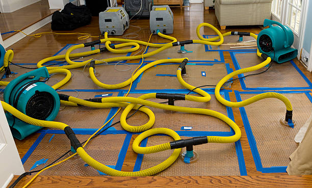 Professional Flood Damage Restoration technician working in Stone Creek, OH